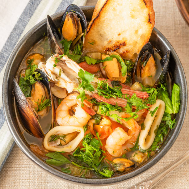 istock Traditional Mediterranean seafood stew in a black bowl closeup. 1134631246