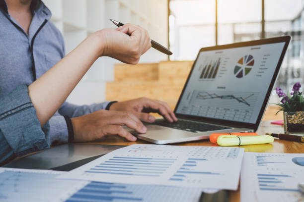 istock Business Colleagues Working At Desk In Office 1134631364