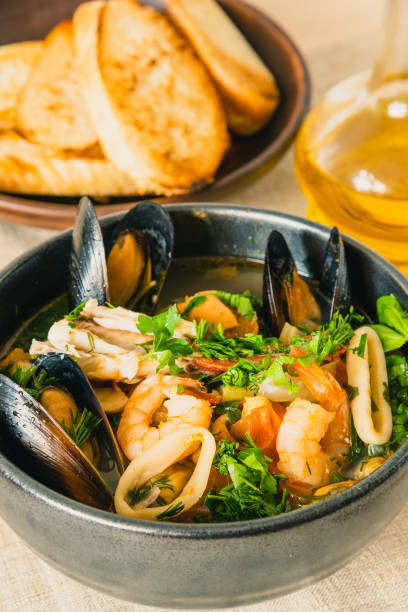 istock Traditional Mediterranean seafood stew in a black bowl, top view. 1134632010