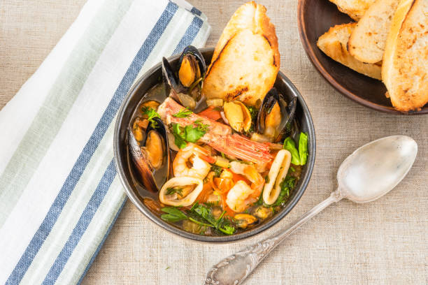 istock Traditional Mediterranean seafood stew in a black bowl, top view. 1134632300