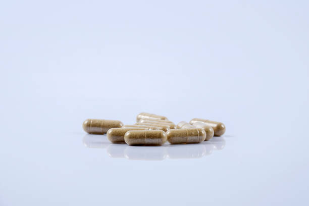 istock Close-Up Of Capsules On Blue Background 1134634237