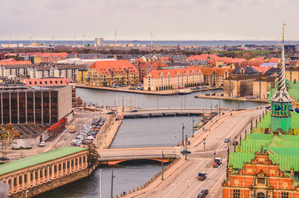 view of børsen, also known as børsbygningen stock exchange, danmarks nationalbank and copenhagen harbor. copenhagen, denmark - shingle bank imagens e fotografias de stock