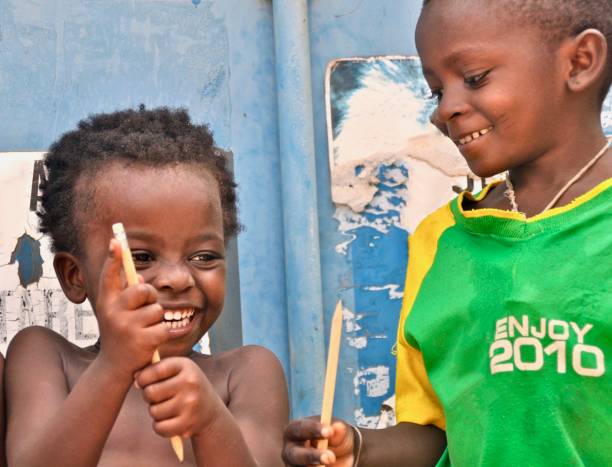 istock Smiling Shirtless Boy With Brother Holding Pencil 1134641553