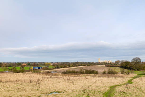 istock Agricultural landscape with minster and railway train in spring, Beverley, UK. 1134643448
