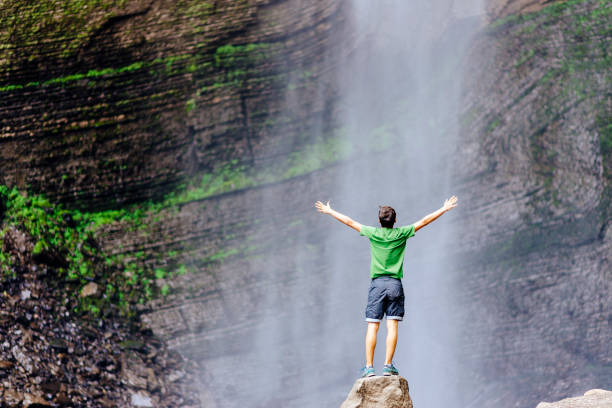 Tourist enjoys the Gocta waterfall in nothern peru stock photo