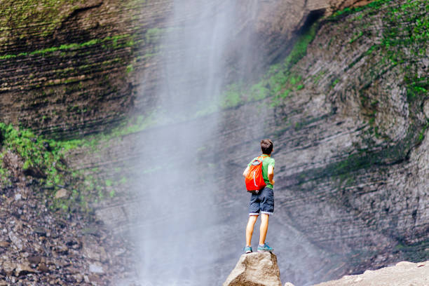 Tourist enjoys the Gocta waterfall in northern peru stock photo