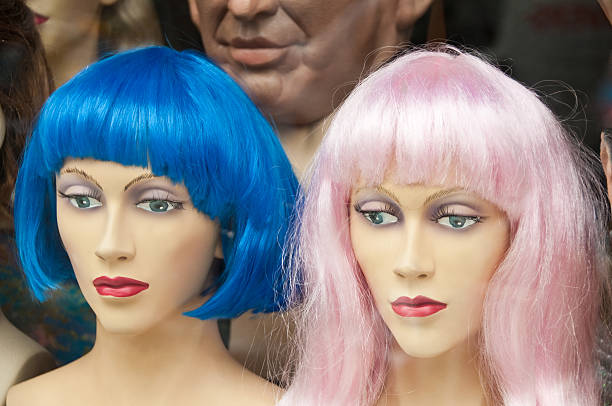 istock Two Manikin heads with colorful wigs 113464467