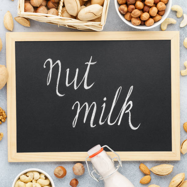 istock Nut milk and ingredients. Alternative milk. Chalkboard lettering 1134654184