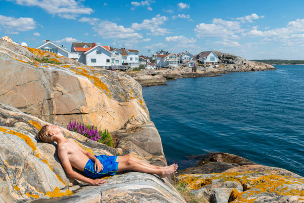 istock Teen sunbathing in Swedens idyllic archipelago 1134654502
