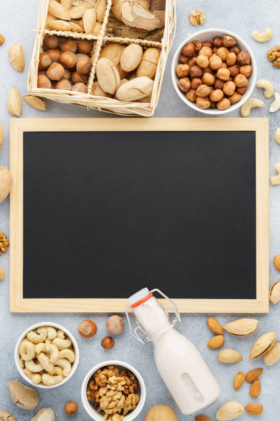 istock Nut milk and various ingredients. Space for recipe. 1134655210