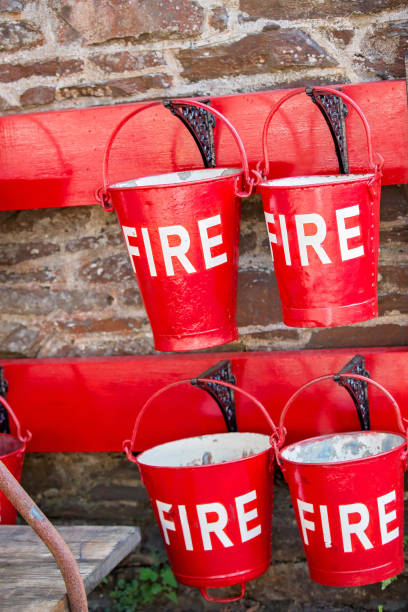 istock Red fire buckets at an old railway station 1134656471