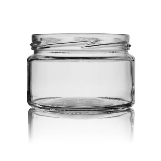 istock empty glass jar without cover with reflection for jam or canned food isolated on a white background 1134656706
