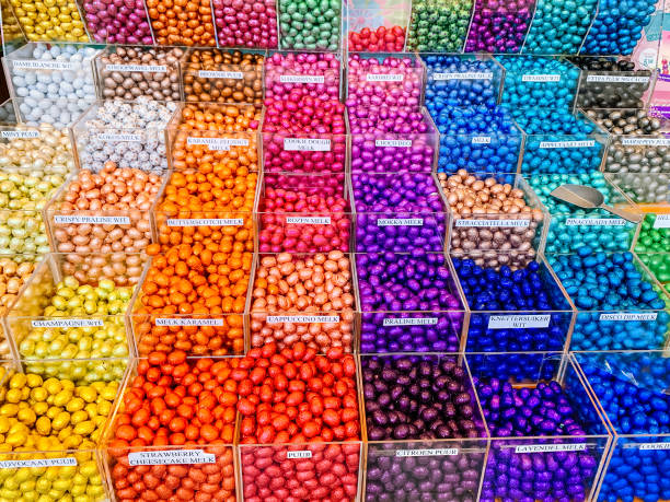 istock Multicolor store front or supermarket with Chocolate eggs in colorful foil for easter 1134660045