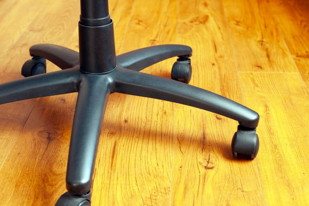 istock legs on wheels from an office chair ride on the floor 1134660437