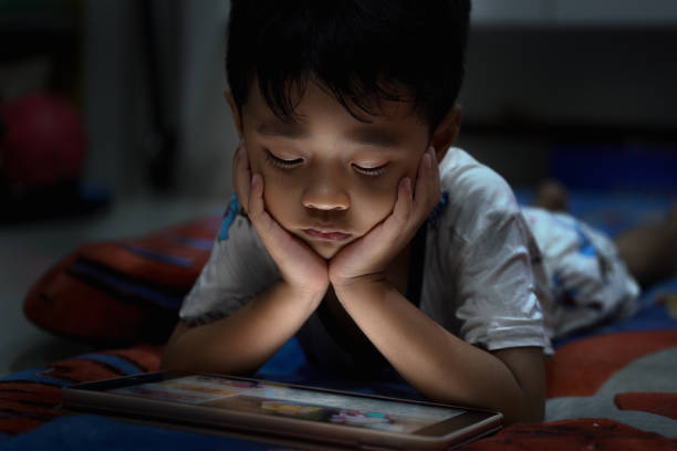 istock Asian boys are watching social media media on tablets. 1134660441