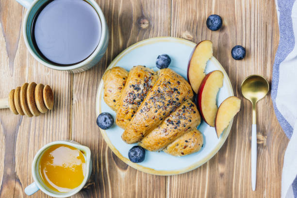 istock Breakfast served with croissants, coffee, orange juice and berries. 1134661457