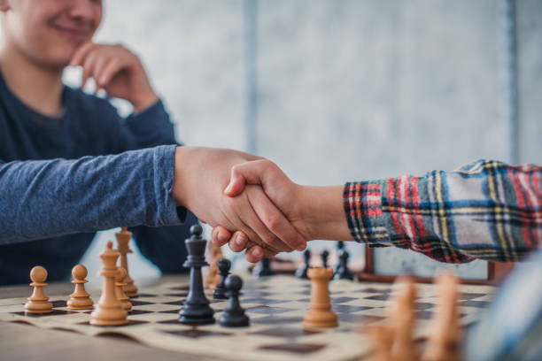 Boys playing chess Two boys playing chess chess timer stock pictures, royalty-free photos & images