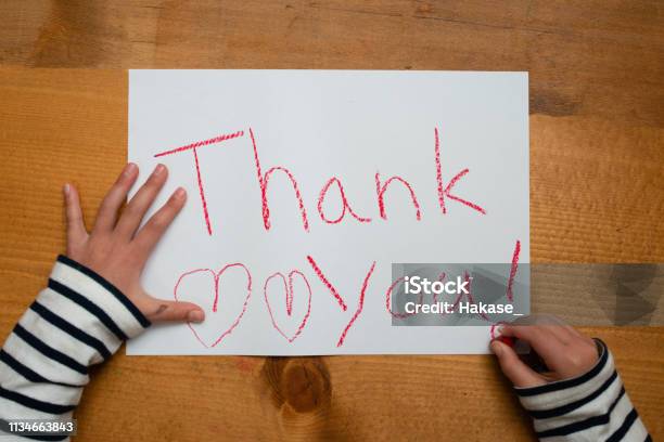 Child Writes Thank You On Paper Stock Photo - Download Image Now - Child, Thank You - Phrase, Writing - Activity