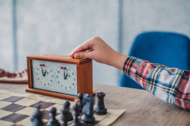 Chess game Boy playing chess chess timer stock pictures, royalty-free photos & images