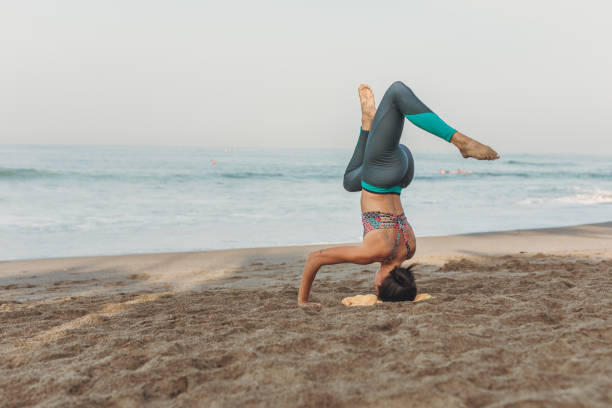 istock Young Woman Stretching At The Beach 1134664933