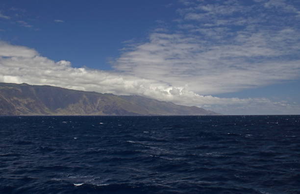 istock clouds ovewr rocky coast, Canary Islands 1134666017
