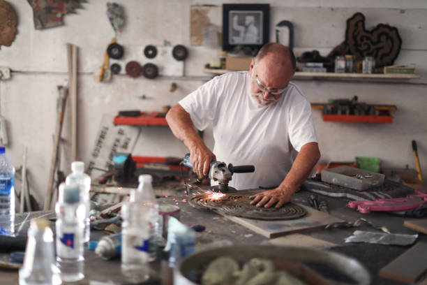 istock a Senior man creating sculptures in his art studio 1134667595