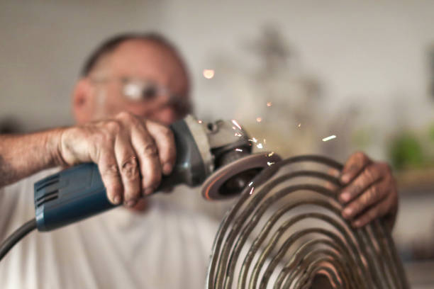 istock a Senior man creating sculptures in his art studio 1134667687