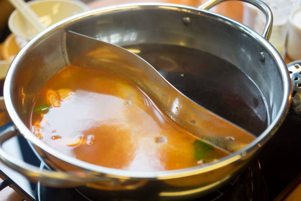 istock Double flavor hot pot in hot pot buffet (black and spicy tom yum soup) 1134667730