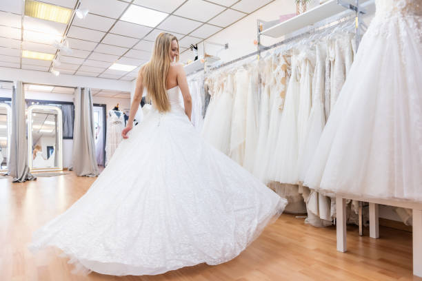 istock Candid bride dancing in bridal shop 1134669092