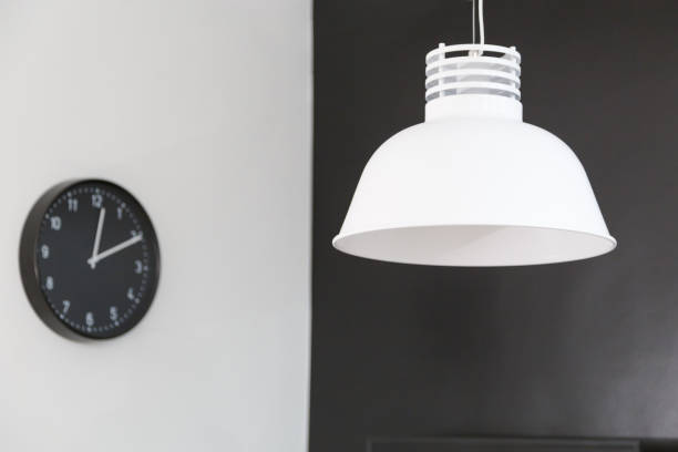 istock White metal loft lamp on black background 1134669875