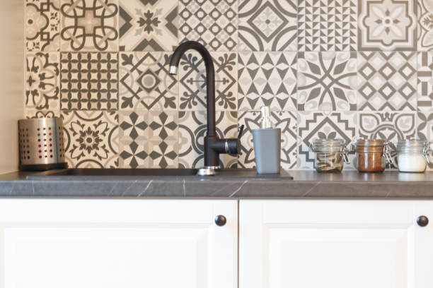 istock Kitchen faucet, sink and jars. 1134669883