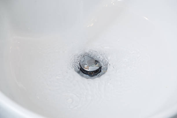 istock Drain chrome valve in white washbasin 1134669910