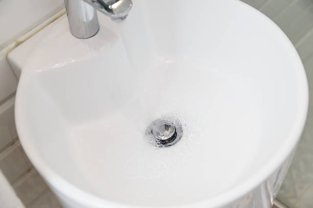 istock Drain chrome valve in white washbasin 1134669911