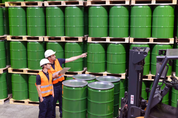 istock group of workers in the logistics industry work in a warehouse with chemicals 1134670161
