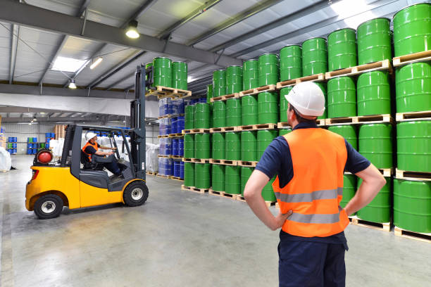 istock group of workers in the logistics industry work in a warehouse with chemicals 1134670190