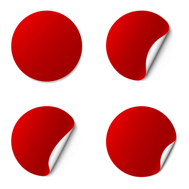 istock Set of red round adhesive stickers with a folded edges, isolated on white background. 1134670952