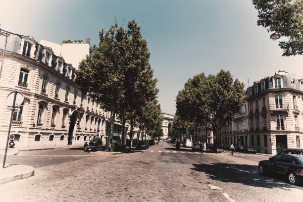 Luxury buildings with world famous Arch de Triomphe on the background. Paris, France