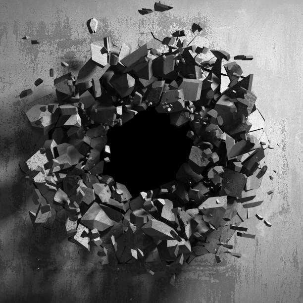 istock Dark cracked broken hole in concrete wall 1134671536