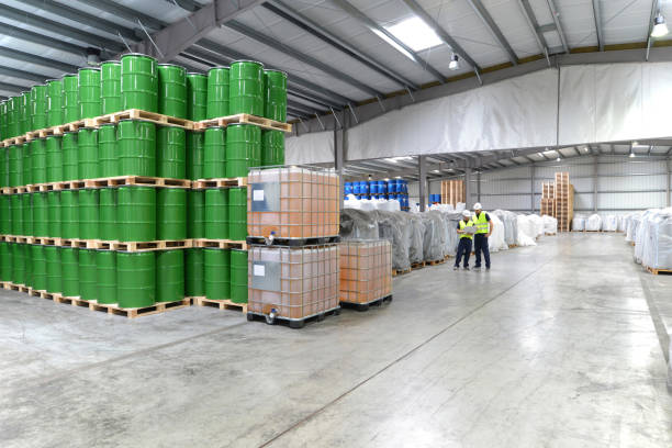 istock group of workers in the logistics industry work in a warehouse with chemicals 1134671737