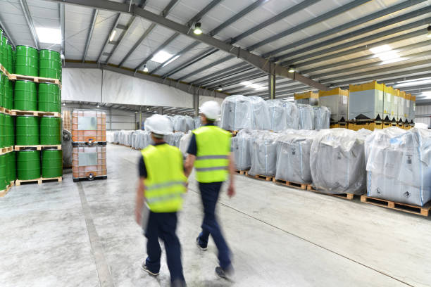 istock group of workers in the logistics industry work in a warehouse with chemicals 1134671962