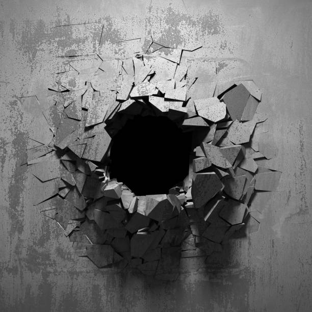 istock Dark cracked broken hole in concrete wall 1134673238