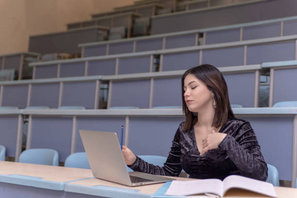istock Woman working on laptop in a classroom 1134675357