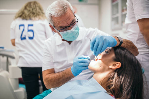 istock Dentist removing a dental cavity 1134676228