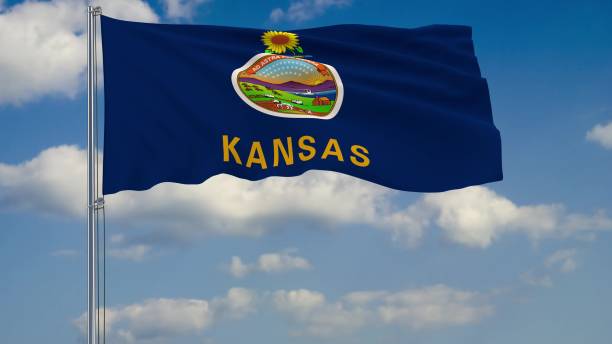 istock Flag of Kansas - US state fluttering in the wind against a cloudy sky 3d rendering 1134676989