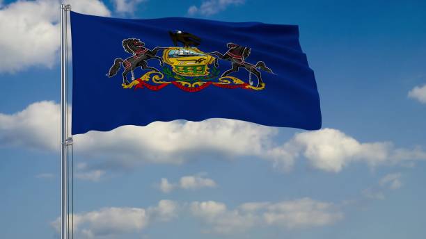 istock Flag of Pennsylvania - US state fluttering in the wind against a cloudy sky 3d rendering 1134677068
