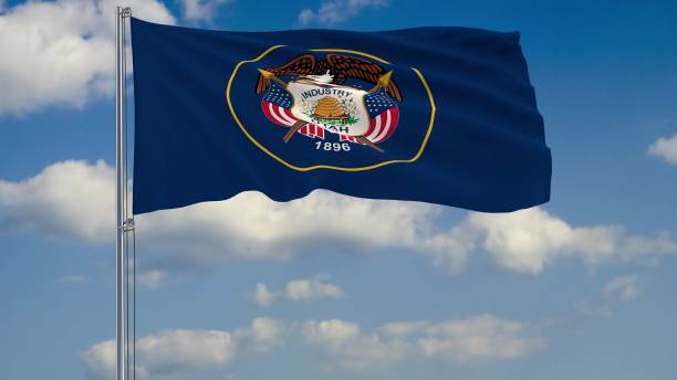 istock Flag of Utah - US state fluttering in the wind against a cloudy sky 3d rendering 1134677076