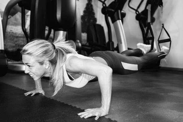 istock Smiling Woman Exercising At Gym 1134679660