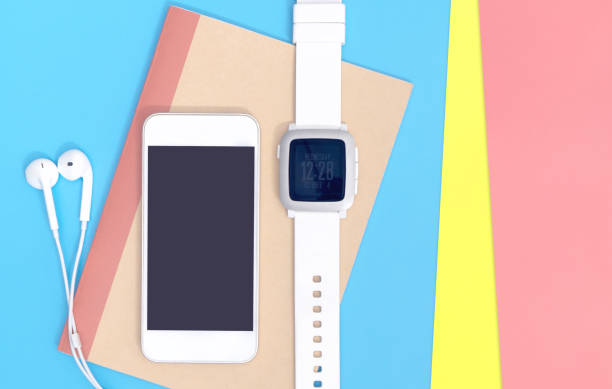 istock Empty mobile phone with smartwatch gadgets on blue