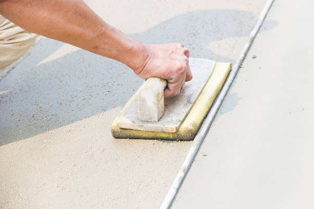 istock Cropped Hand Of Man Leveling Wet Cement With Tool 1134682596