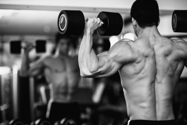 istock Shirtless Man Exercising At Gym 1134683476